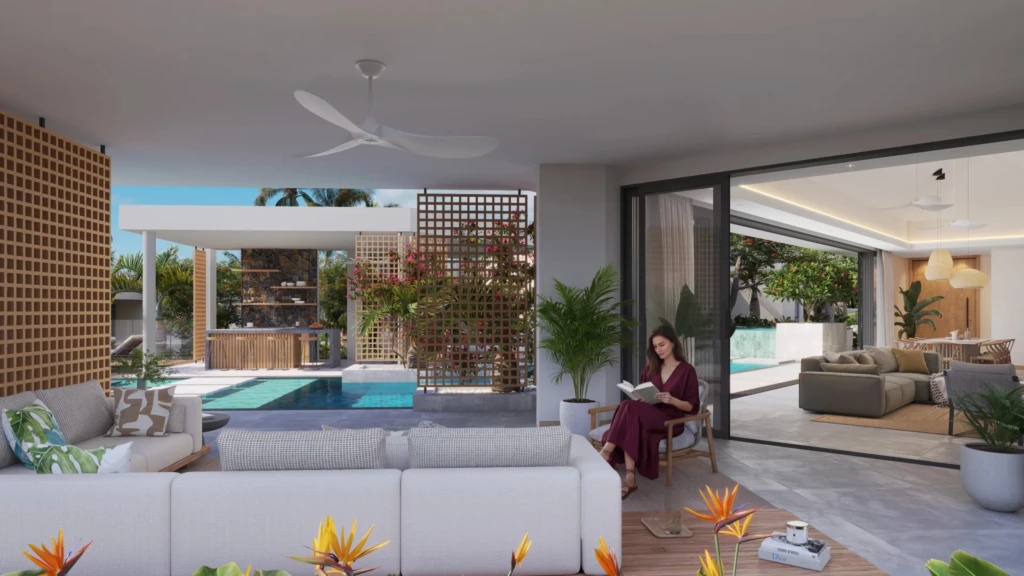 Salon lumineux avec accès à une piscine extérieure et un espace détente intérieur. -Elegance Properties