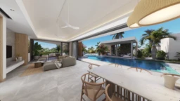 Ce magnifique salon lumineux offre une vue imprenable sur la piscine et le jardin tropical. -Elegance Properties