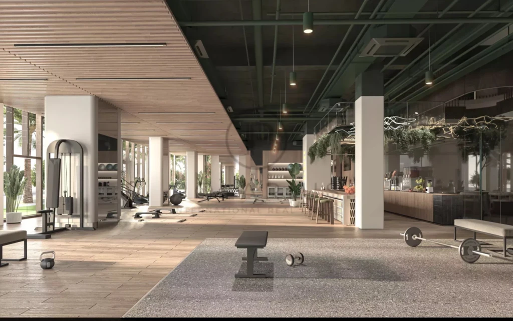 Une salle de sport moderne et spacieuse avec des équipements de musculation.