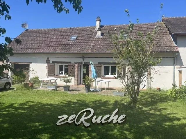 Charmante maison avec jardin ensoleillé, idéale pour la famille.