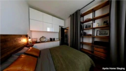 Chambre moderne avec rangements intégrés et ambiance chaleureuse.