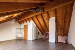 Bright attic with wooden beams and parquet. Nobody inside