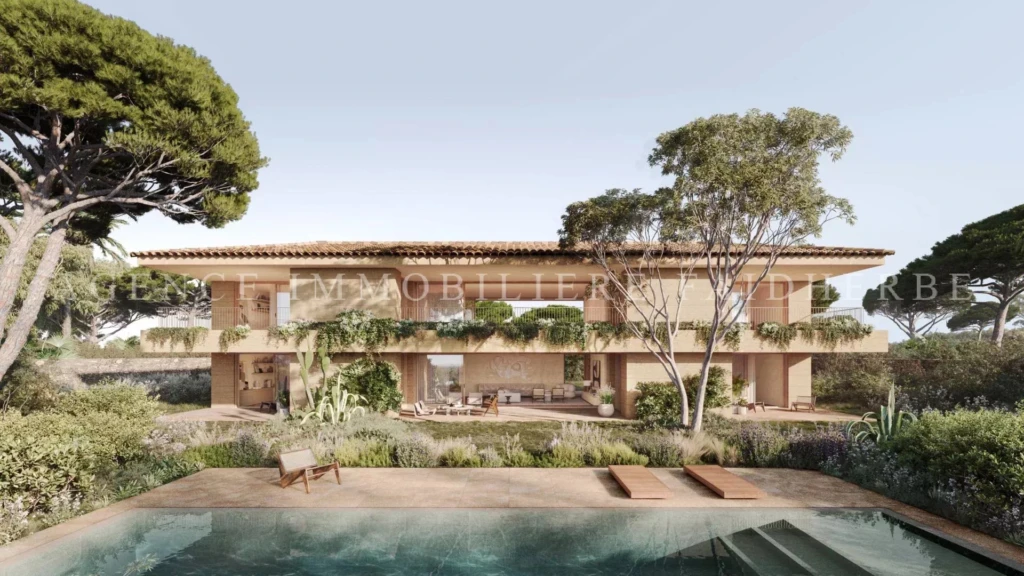 Belle maison moderne entourée de nature, avec une piscine extérieure.