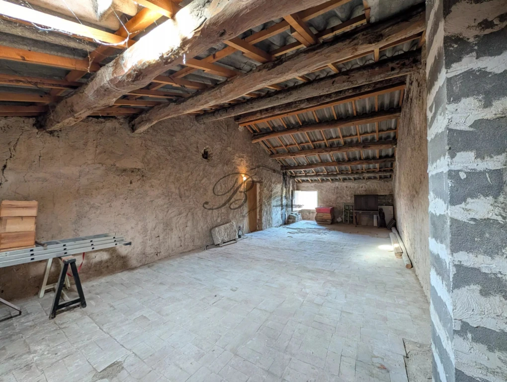 LA BASTIDE DES JOURDANS, A scenic view of a rustic stone terrace overlooking a landscape with trees