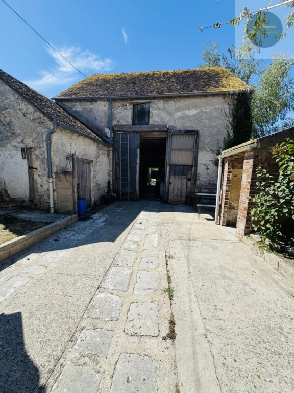 maison avec façade en pierres et briques