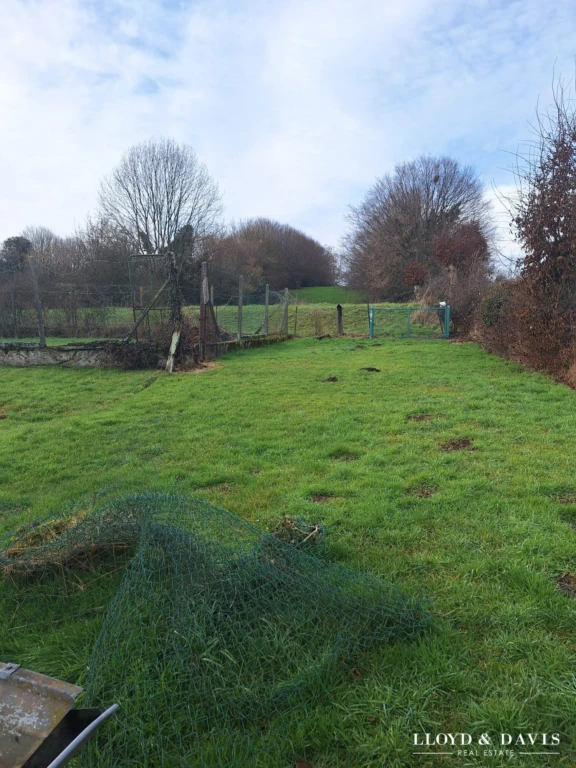 terrain derriere maison
