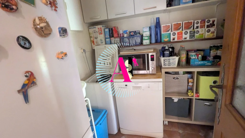 Arrière cuisine et buanderie